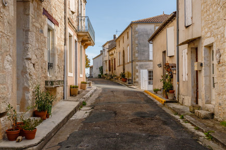 Monflanquin, France - October 17, 2021: architectural detail of typical houses in the city center on...