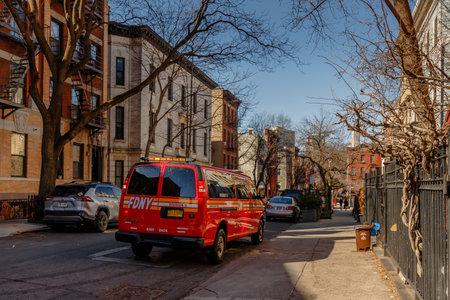 Brooklyn, New York, USA - February 11, 2023: FDYN fire engines in front of Engine 205 H&L 118 fire station garage door in Brooklyn next to Manhattan on a winter dayのeditorial素材
