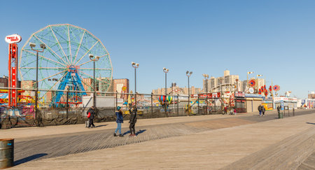 New York City, Brooklyn, USA - February 18, 2023: street atmosphere in front of closed Coney Island attractions with people walking on a winter dayのeditorial素材