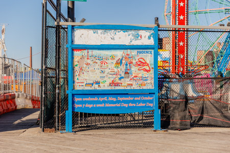 New York City, Brooklyn, USA - February 18, 2023: Map and opening hours of closed Coney Island attractions on a winter dayのeditorial素材