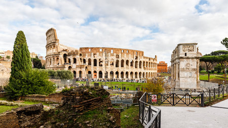 Rome, Italy - December 27, 2023: view of the Coliseum of Rome visited by tourists in the historic...
