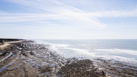 Drone view of Ragounite beach in Jard sur Mer, Vendee, France on a spring day with blue skyの写真素材
