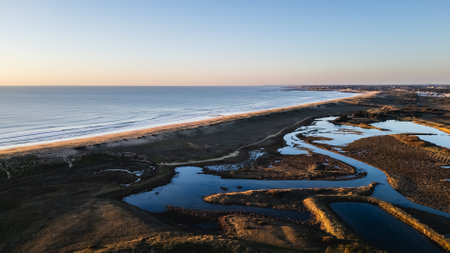 Aerial drone view of the Gachere marshes in Brem sur Mer, Vendee, France on a winter day at sunsetの写真素材