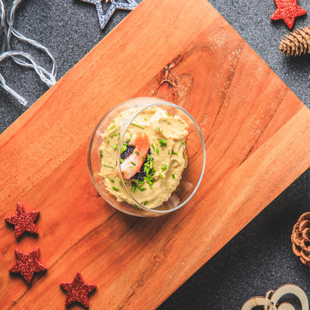 Verrine avocado shrimp pink fresh cheese guacamole chives cream lumpfish roe - decorated for Christmas in studioの写真素材