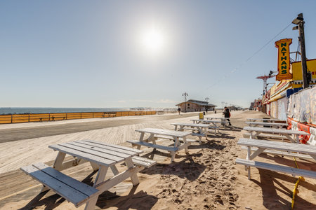 New York City, Brooklyn, USA - February 18, 2023: street atmosphere in front of closed Coney Island attractions with people walking on a winter dayのeditorial素材