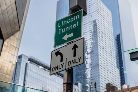 Manhattan, New York, USA - February 16, 2023: Lincoln Tunnel Only way road sign on a downtown street on a gray winter dayのeditorial素材