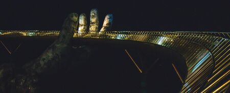Golden bridge in Bana Hills French village, Sun World, Da Nang, Central Vietnamの写真素材