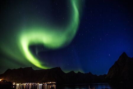 Northern lights above Reine in Lofoten islands in Norwayの写真素材