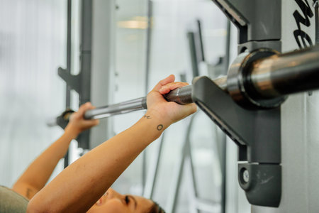 Asian sports woman in the gym, athletes training, workout lifting weight, plank and push up. tattoo...