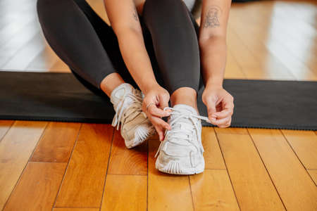 Asian sports woman in the gym, athletes training, workout lifting weight, plank and push up. tattoo thai girlの写真素材