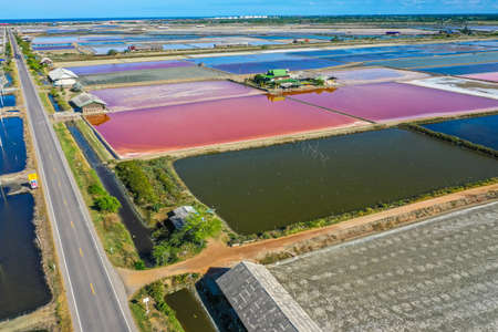 Phetchaburi Salt flats Naklua, farms and farmers collecting salt in Phetchaburi, Thailandの写真素材