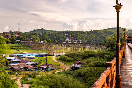Mon Bridge, old wooden bridge at sunset in Sangkhlaburi, Kanchanaburi, Thailandの写真素材