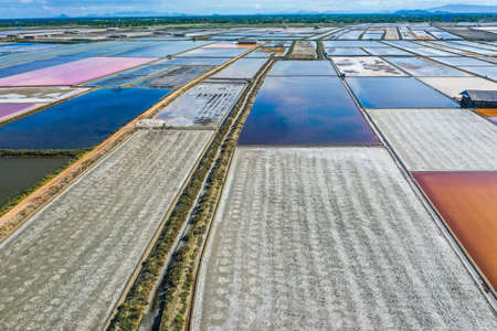 Phetchaburi Salt flats Naklua, farms and farmers collecting salt in Phetchaburi, Thailandの写真素材