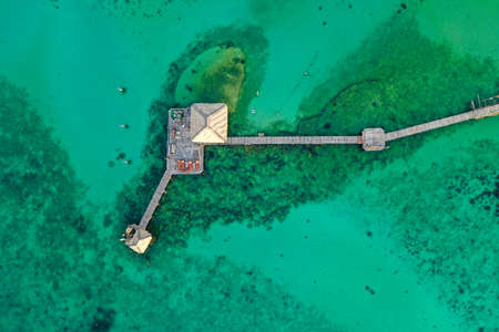 Wooden beach bar in sea and hut on pier in koh Mak island, Trat, Thailand