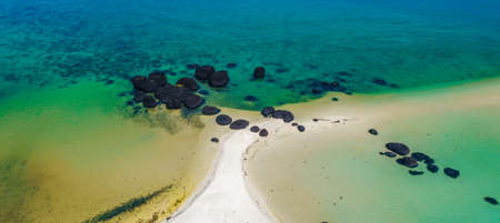 Beautiful tropical island koh Kham, white sand beach with volcanic rocks, near koh Mak, Trat,...