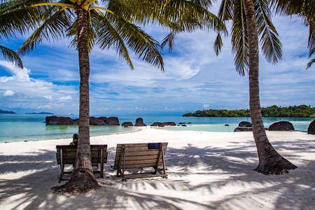 Beautiful tropical island koh Kham, white sand beach with volcanic rocks, near koh Mak, Trat,...