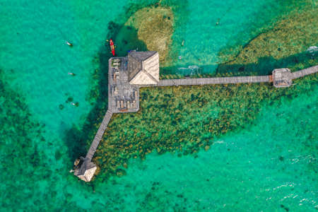 Wooden beach bar in sea and hut on pier in koh Mak island, Trat, Thailandの写真素材
