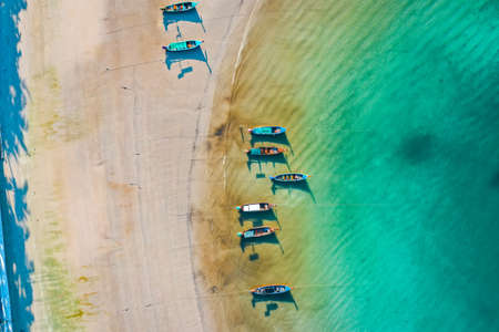 Long tail boats in Patong beach in Phuket Province, Thailandの写真素材