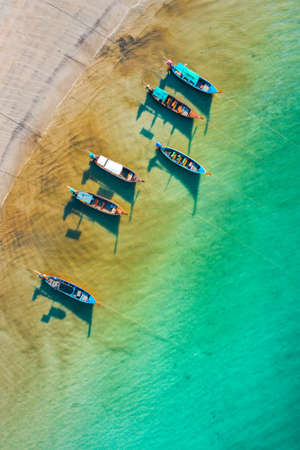 Long tail boats in Patong beach in Phuket Province, Thailandの写真素材