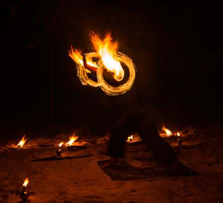 Fire show on the beach at night in Phuket, Thailand