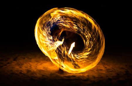 Fire show on the beach at night in Phuket, Thailandの写真素材