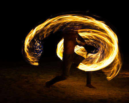 Fire show on the beach at night in Phuket, Thailandの写真素材