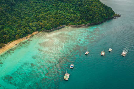 Coral island, koh He, beach and boats in Phuket province, Thailand