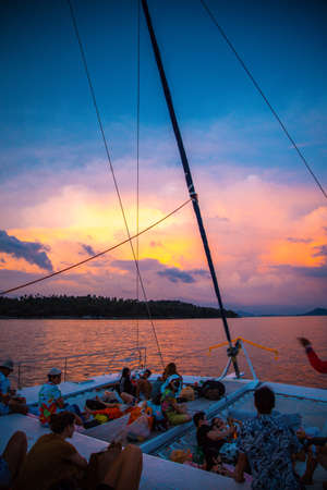Sailing boat during sunset at Promthep Cape in Phuket peninsula, Thailand