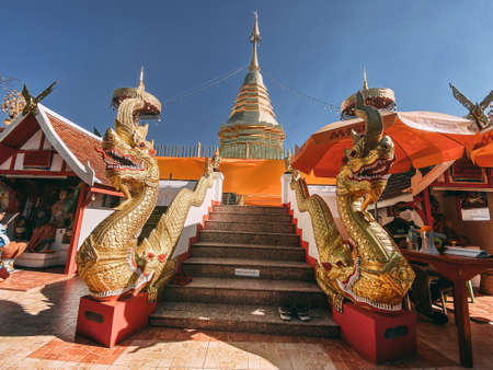 Wat Phrathat Doi Kham, Buddha pagoda and golden chedi in Chiang Mai, Thailandの写真素材