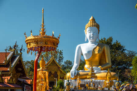 Wat Phrathat Doi Kham, Buddha pagoda and golden chedi in Chiang Mai, Thailandの写真素材