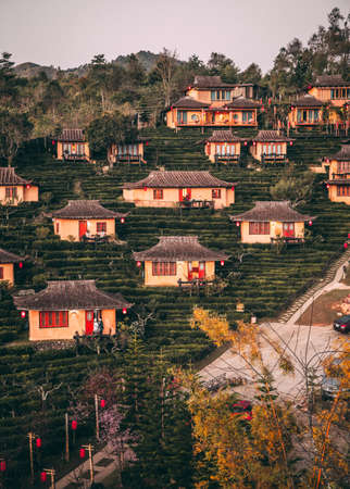 Sunrise with fog over Ban Rak thai, chinese village near a lake in Mae Hong Son, Thailandの写真素材