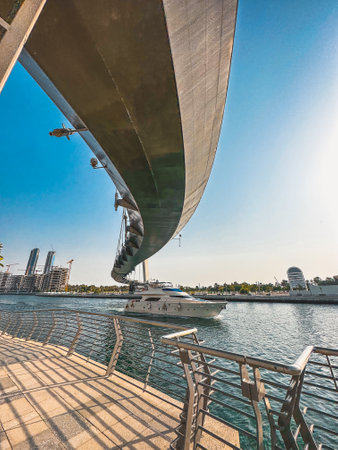 Dubai Water Canal Tolerance Bridge, pedestrian bridge with water taxi, in Dubai, UAEの写真素材