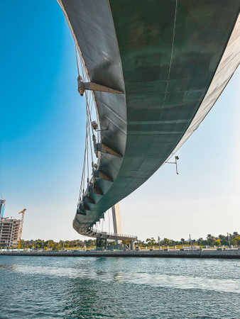 Dubai Water Canal Tolerance Bridge, pedestrian bridge with water taxi, in Dubai, UAEの写真素材
