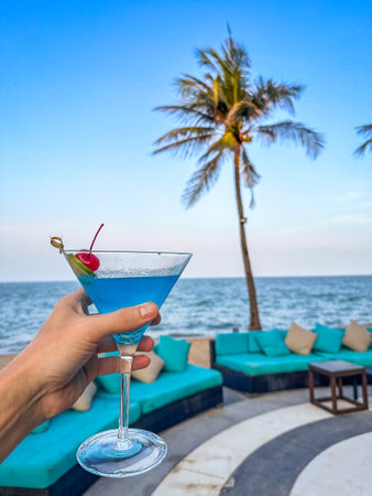 Two cocktails blue and orange at a beach bar in Hua Hin, Thailandの写真素材