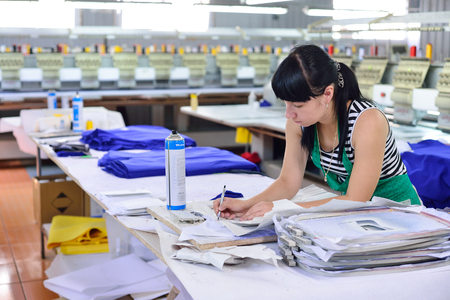 GUKOVO, RUSSIA - SEPTEMBER, 2016: Workers work in a garment factoryのeditorial素材