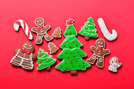 Christmas gingerbread on the red background, Christmas and New Year concept