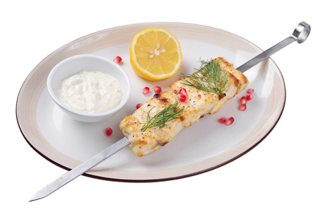 sturgeon with lemon sauce and grilled. Isolated.の写真素材