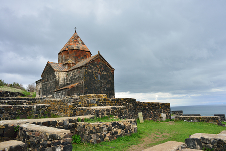 Shrine of the Armenian people. Temple on Lake Sevan. Thunder Sky. orthodoxy