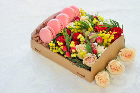French macaroon heart-shaped Valentine's Day, the box with flowers, pink roses, background for cardの写真素材