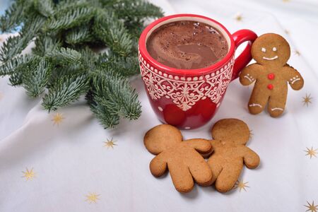 red cup with cocoa and ginger humans