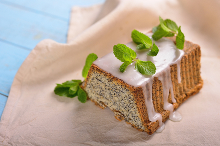 cake with poppy seeds in a creamy mint frosting petalsの写真素材