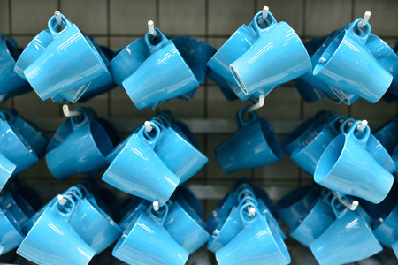 Selling blue mugs. The concept of trade in dishes. Big choice.の写真素材