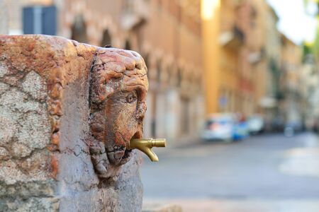 A tap of a drinking fountain in the street of Verona.の写真素材