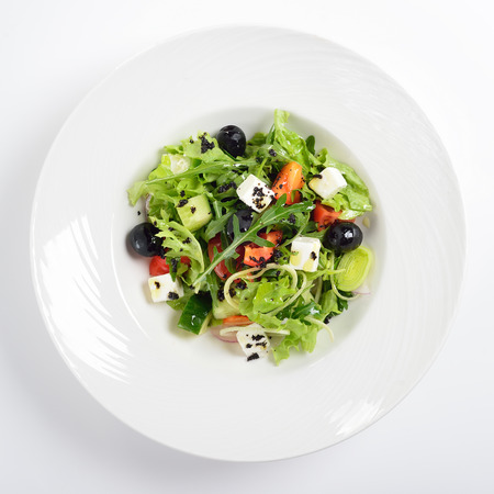 Fresh Greek salad in a bowl, top viewの写真素材