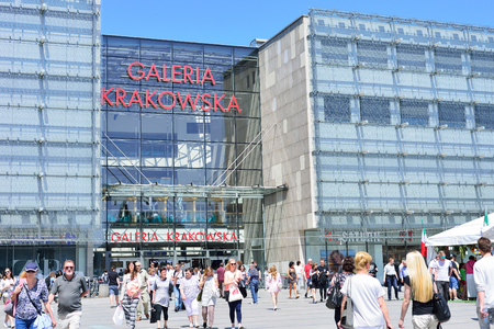 KRAKOW, POLAND - JUNE, 2017: more people walk at the entrance of Galeria Krakowska shopping center.のeditorial素材