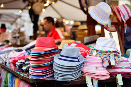VERONA, ITALY - MAY, 2017: Stylish hats on the market. Sale of hats. European market of souvenirs and clothes.のeditorial素材