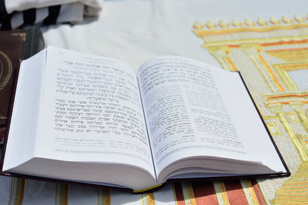 JERUSALEM, ISRAEL - APRIL 2017: Talmud Tora Tanach Books lying on the table during the prayer in the Bar Mitzwa Ceremony at the Western Wall Jerusalem (Kotel)のeditorial素材