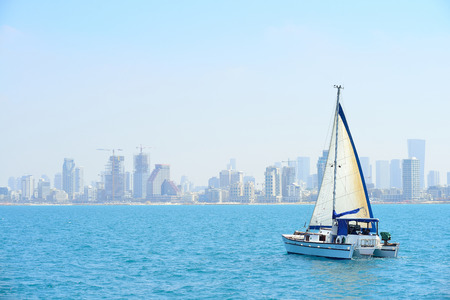 TEL AVIV, ISRAEL - APRIL, 2017:  A luxury yacht in the open sea against the backdrop of Tel Aviv.のeditorial素材