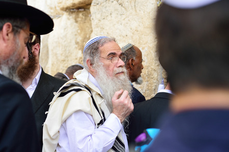 JERUSALEM, ISRAEL - APRIL 2017: Jewish hasidic pray a the Western Wall, Wailing Wall the Place of Weeping is an ancient limestone wall in the Old City of Jerusalem.のeditorial素材