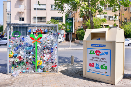 TEL AVIV, ISRAEL - APRIL, 2017: containers for the disposal of plastic bottles and clothes on Tel Aviv Street, environmental safety.のeditorial素材
